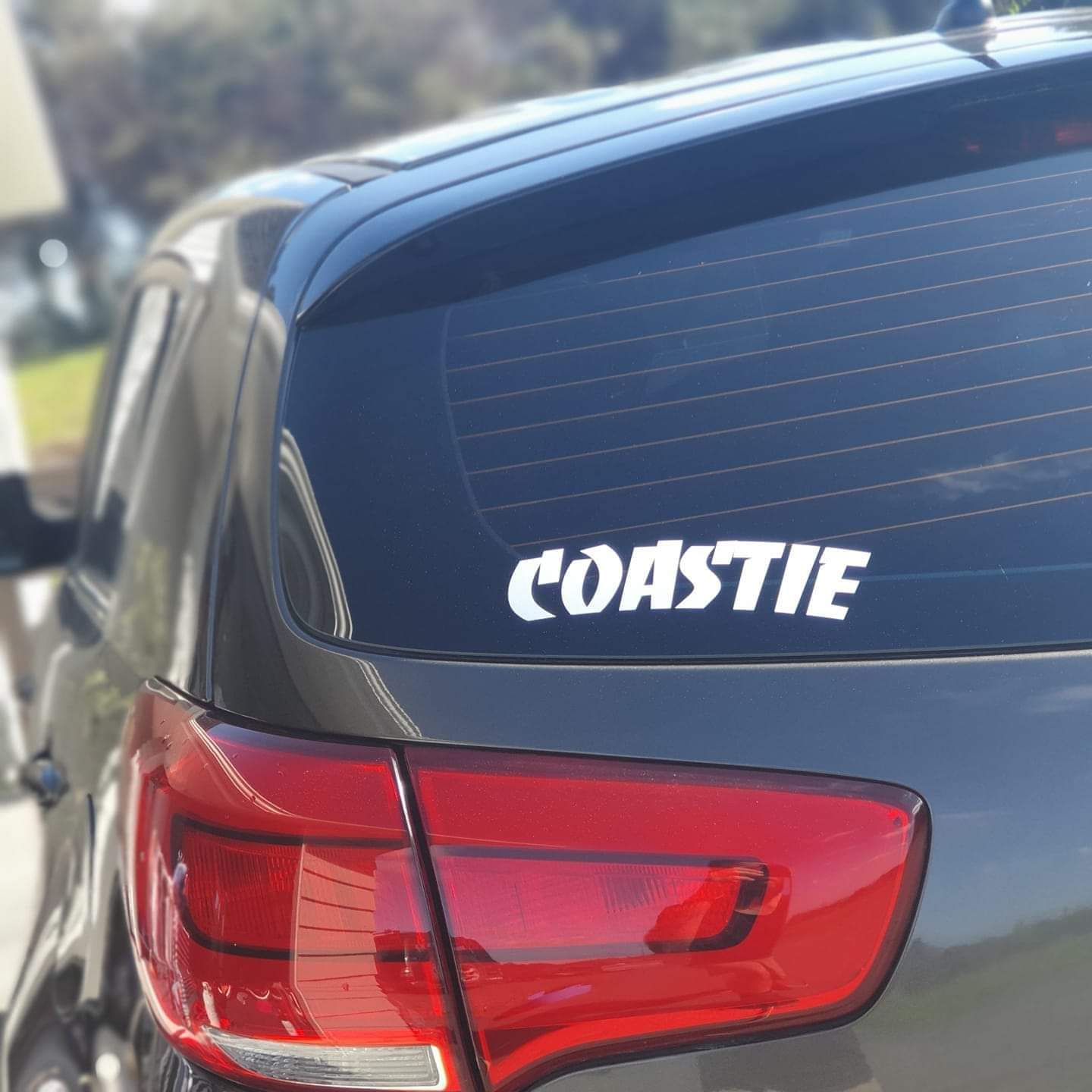 Coastie decal on a car's rear window